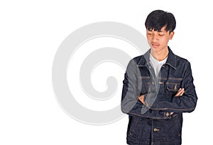 An armcroosing and sadden guy in jeans jacket.