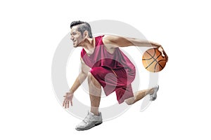 Handsome asian man playing basketball