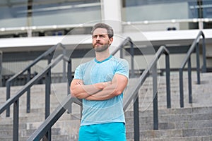 Handsome athlete beard man standing confidently. Staying fit and healthy. having a good sport shape. he is always in