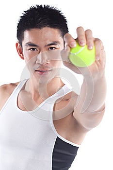Handsome athletic chinese sportsman, tennis ball