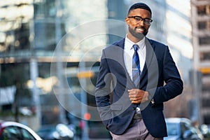 Handsome attractive cheerful african american executive business man at the workspace office