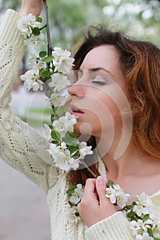 Woman smell tree flower