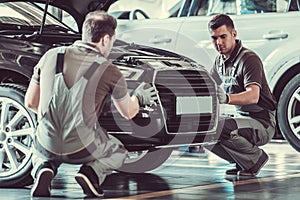 Handsome auto service workers