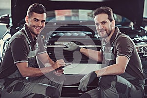 Handsome auto service workers