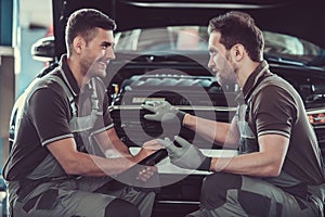 Handsome auto service workers