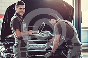 Handsome auto service workers