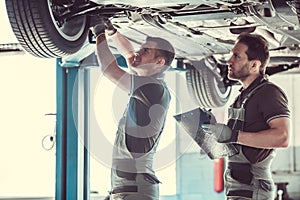 Handsome auto service workers