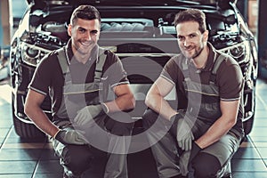 Handsome auto service workers