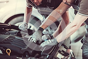 Handsome auto service workers