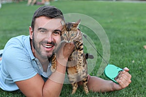 Handsome bachelor with his pet outdoors