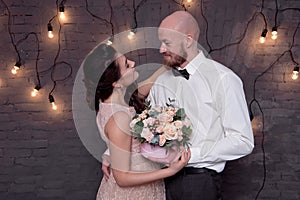 Handsome bald man with a beard make proposal for his girlfriend
