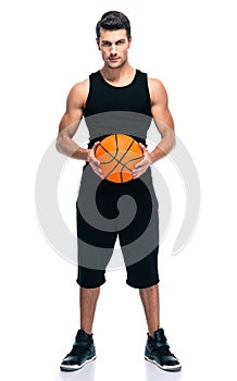 Handsome basketball player with ball