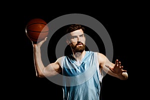 Handsome basketball player shooting ball