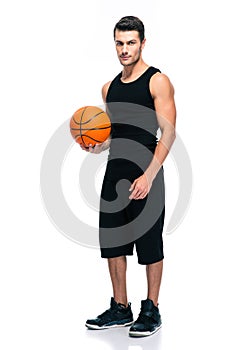 Handsome basketball player standing isolated