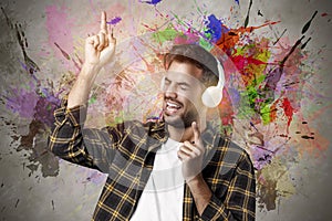 Handsome beard guy with headphones enjoying music