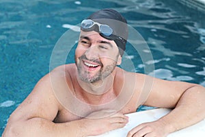 Handsome bearded male swimmer smiling