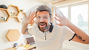 Handsome bearded man with facial expression gesturing with his hands