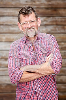 Handsome bearded man in his 50s standing outside