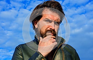 Handsome bearded man in leather jacket. Mens beauty. Fashion male model. Outdoors portrait.