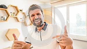 Handsome bearded man smiling gesturing with his hands