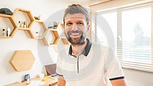 Handsome bearded man smiling posing standing indoors