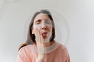 Handsome bearded woman suffering from toothache, closeup,