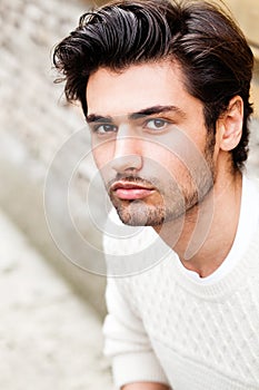 Handsome beautiful young man outdoor. Fashion hairstyle