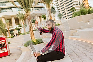 Handsome beautiful young man using mobile phone