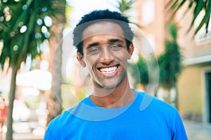 Handsome black african man smiling happy outdoors