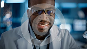 Handsome Black Man Wearing Glasses Smiling Charmingly Looking at Camera. Young Intelligent Male