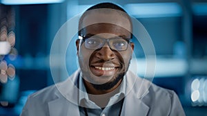 Handsome Black Man Wearing Glasses Smiling Charmingly Looking at Camera. Young Intelligent Male