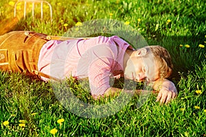 Blond bavarian man sleeping in the grass