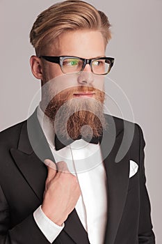 Handsome blonde man wearing a tuxedo