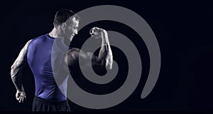 Handsome bodybuilder man with muscular body training in gym