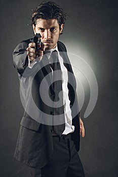 Handsome bodyguard aiming photo