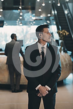 handsome bodyguard waiting for businessman