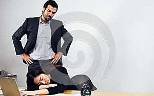 Handsome boss dissatisfied, angry while standing behind his female employee who sleeping in working hour