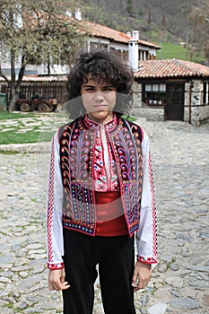 A handsome boy in a Bulgarian folklore costume