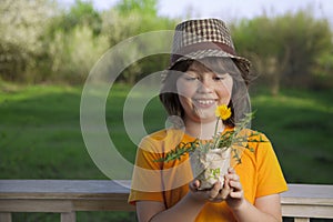 Handsome boy with dandelion flower summer outdoors