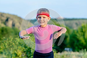 Handsome Boy with Headband Enjoying at the Field