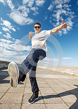 Handsome boy making dance move