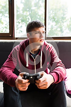 Handsome boy plaing video games