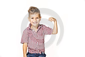 Handsome boy shows his strength on white background