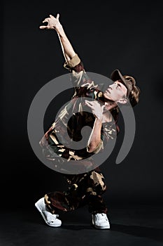 Handsome breakdancer in military uniform
