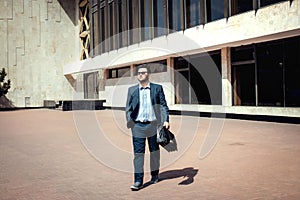 Handsome busines man walking in the street