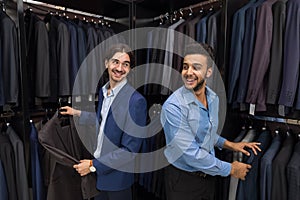 Handsome Business Man Fashion Shop, Customers Choosing Clothes In Retail Store
