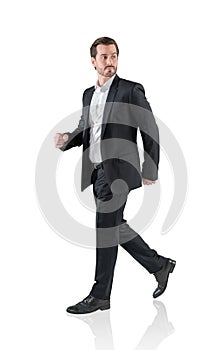 Handsome business man go walk making step, businessman wear elegant black suit. Isolated over white background. The concept of hi-