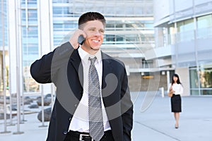 Handsome Business Man at Office on Phone