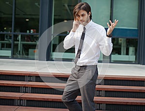 Handsome business man on a phone call