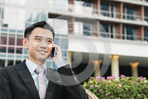 Handsome business man speaking mobile phone